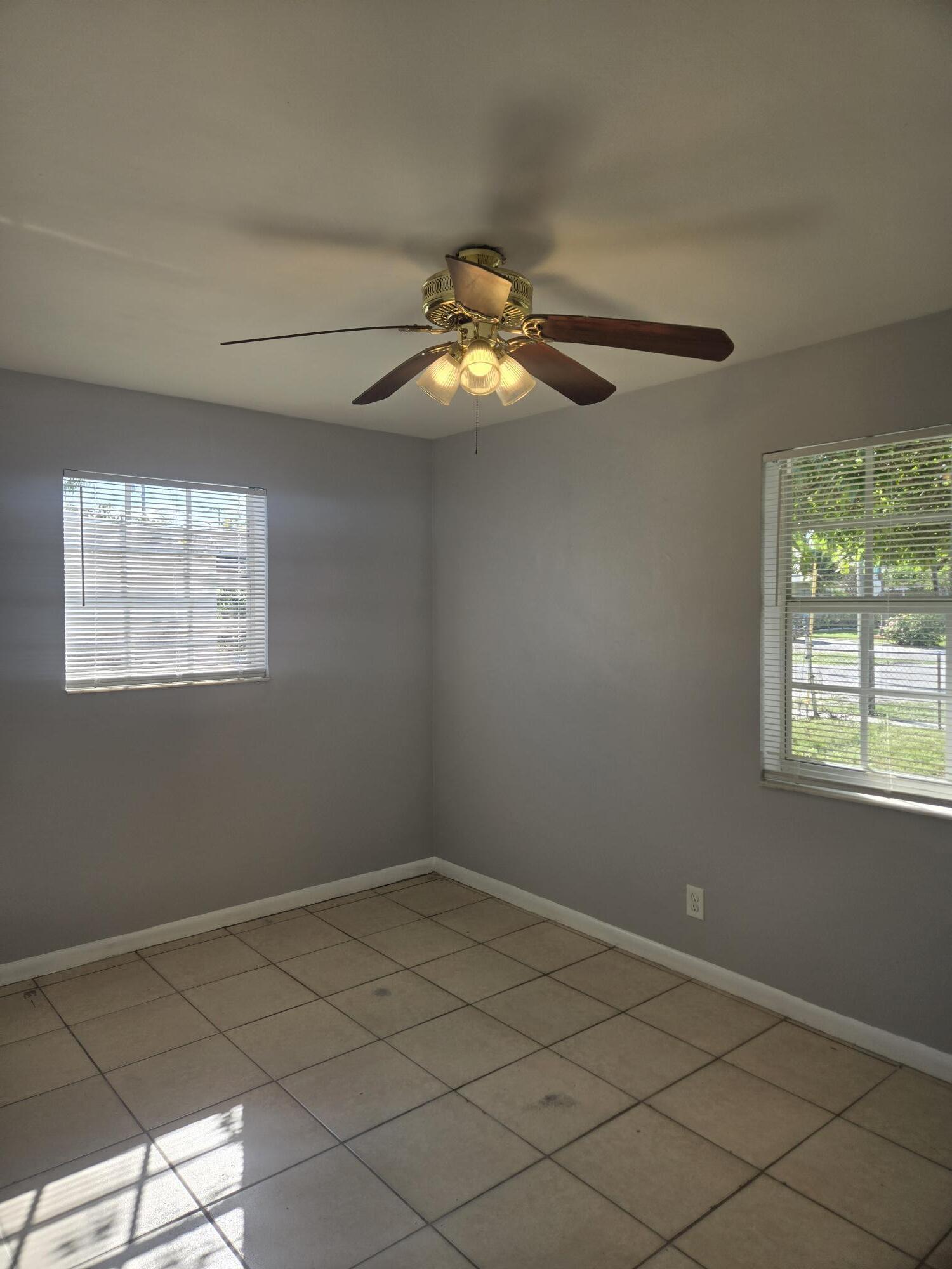 2000 Northwest 2nd Court Boynton Beach, FL 33435 - Photo 5 of 6 a room with chandelier fan and window