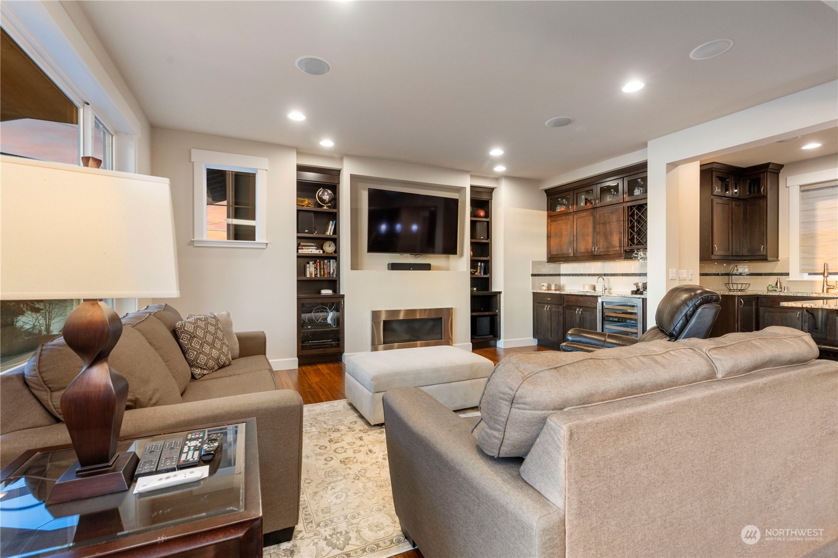 3318 Lake Washington Boulevard North Renton, WA 98056 - Photo 11 of 40 a living room with fireplace furniture and a flat screen tv