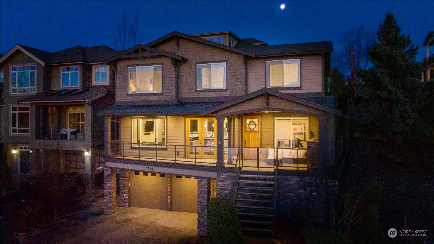 3318 Lake Washington Boulevard North Renton, WA 98056 - Photo 2 of 40 a front view of a house with a yard