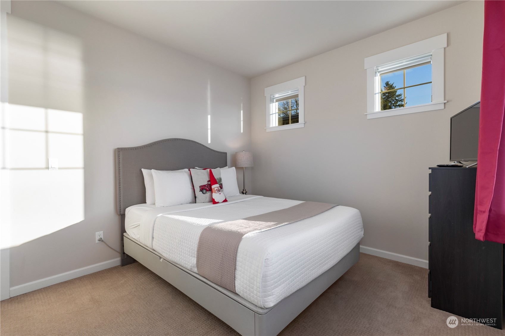 3318 Lake Washington Boulevard North Renton, WA 98056 - Photo 24 of 40 a bedroom with a bed and a window