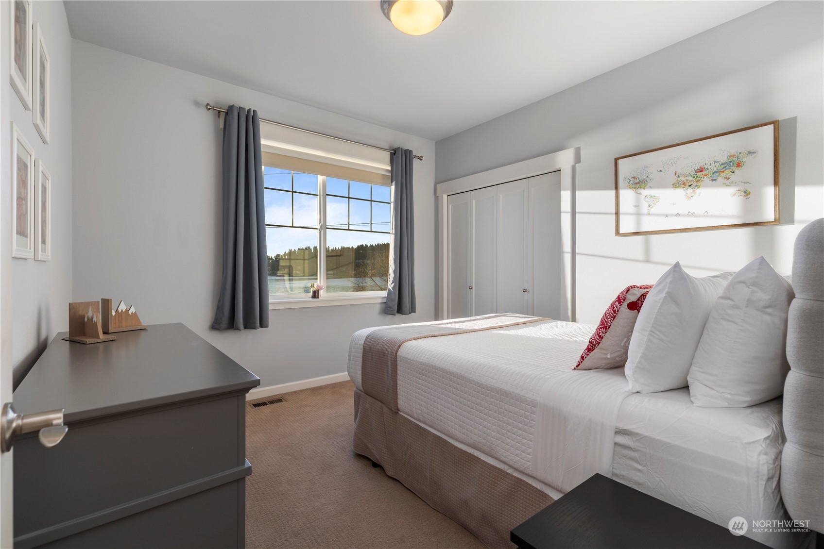 3318 Lake Washington Boulevard North Renton, WA 98056 - Photo 25 of 40 a bedroom with a bed and a window