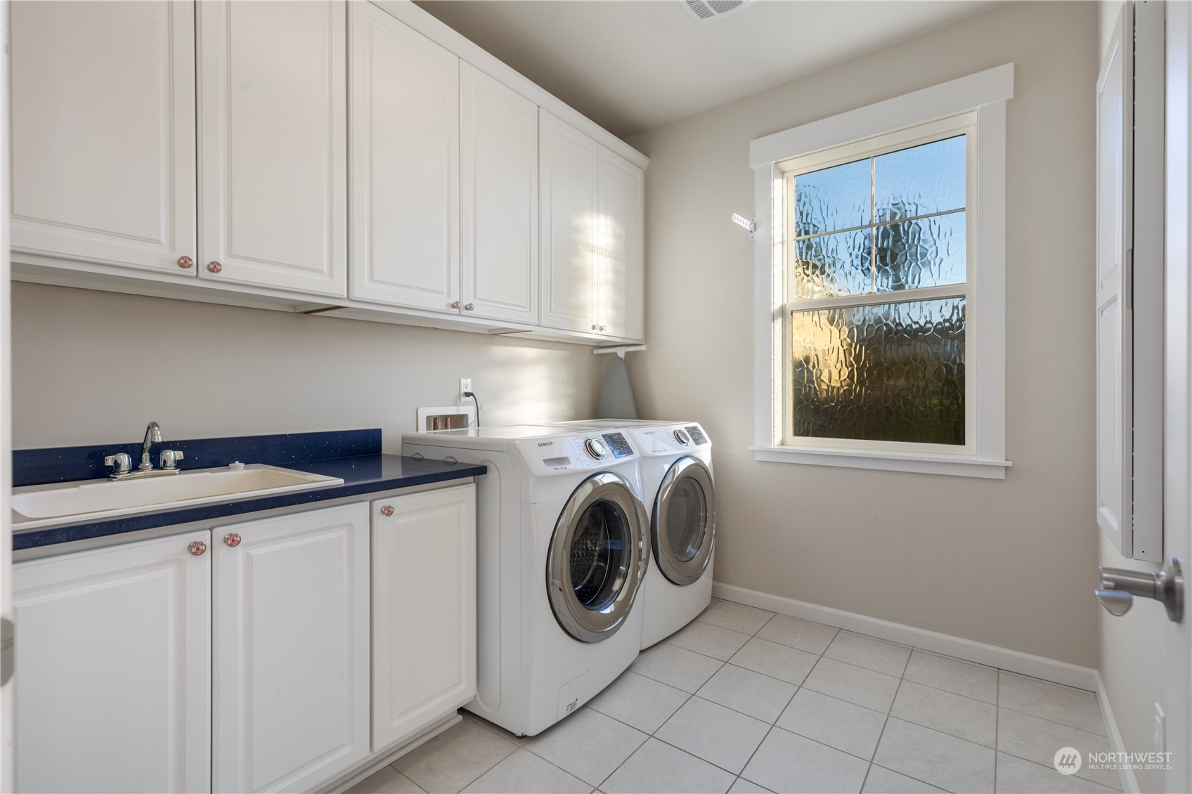 3318 Lake Washington Boulevard North Renton, WA 98056 - Photo 32 of 40 a utility room with sink dryer and washer