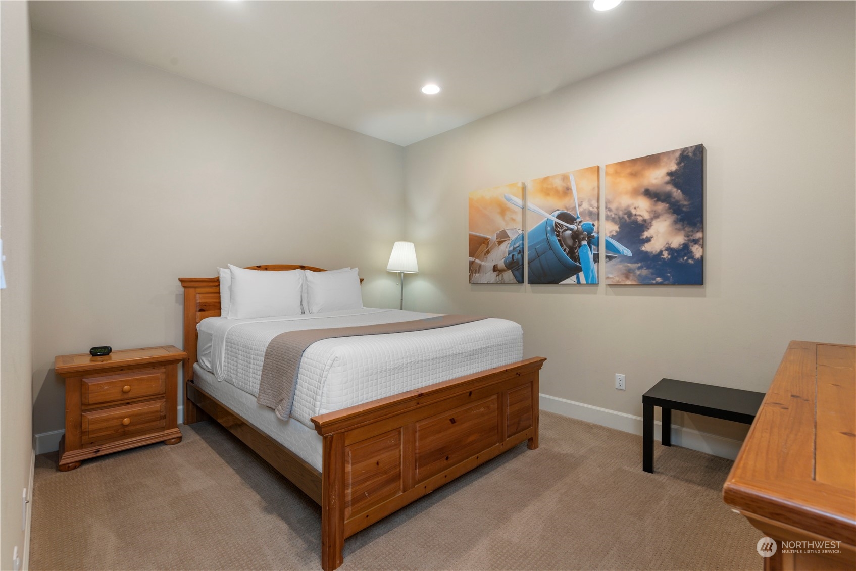 3318 Lake Washington Boulevard North Renton, WA 98056 - Photo 35 of 40 a bedroom with a bed and a painting on the wall