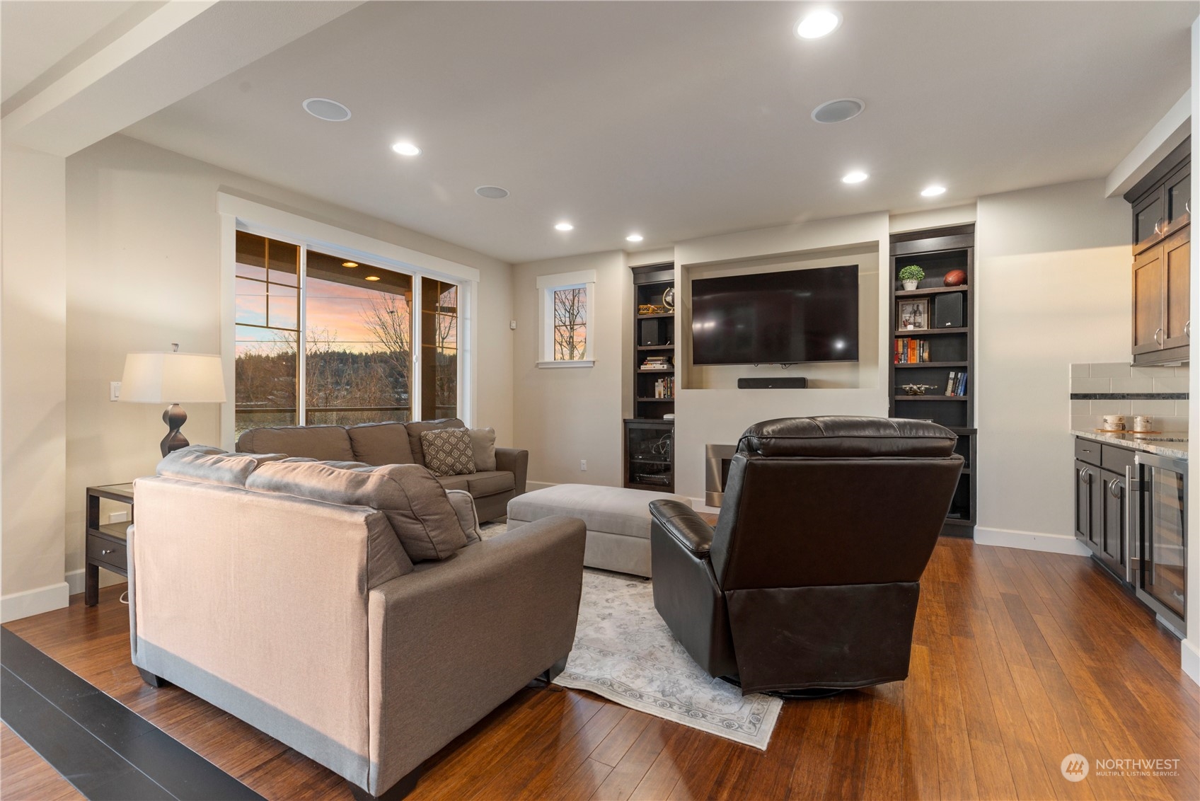 3318 Lake Washington Boulevard North Renton, WA 98056 - Photo 10 of 40 a living room with furniture and a flat screen tv