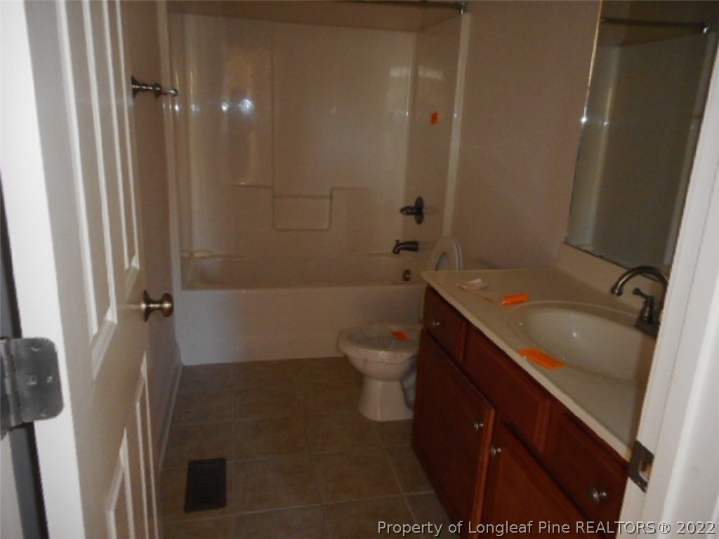 206 Blueridge Road Fayetteville, NC 28303 - Photo 12 of 16 a bathroom with a sink a toilet and shower