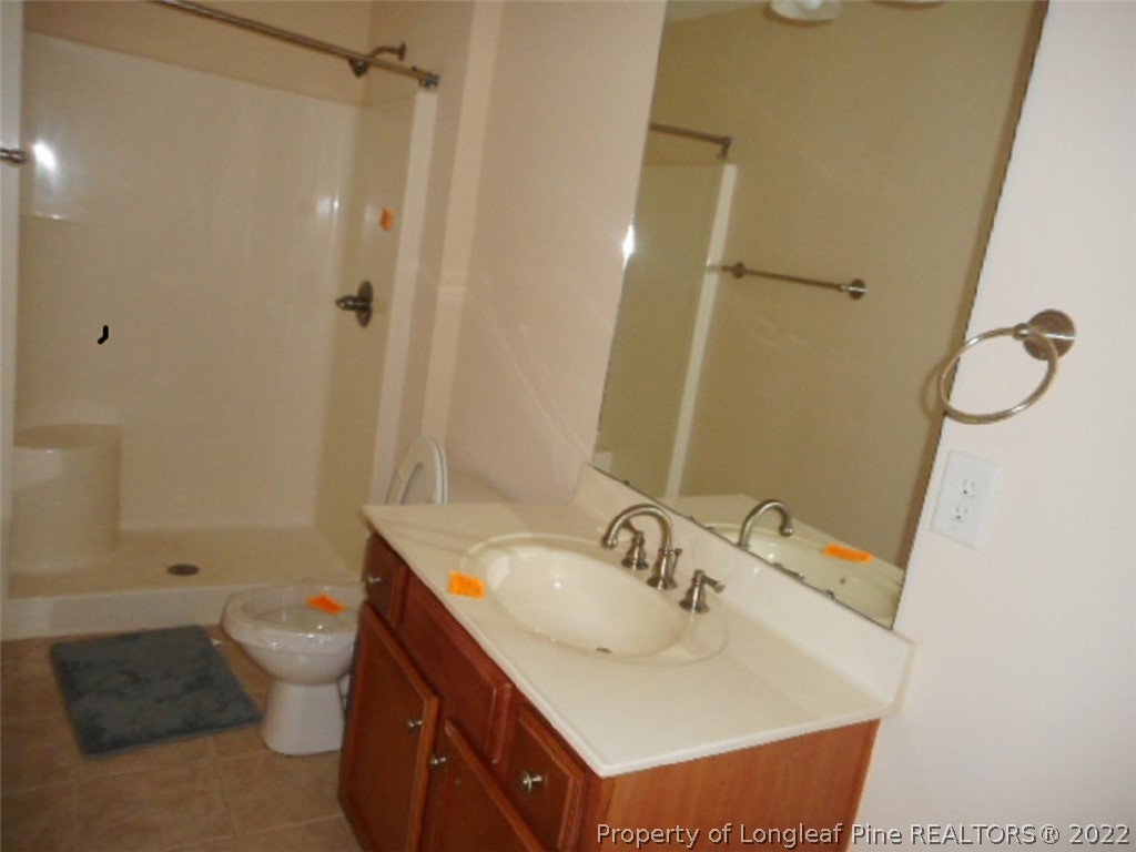 206 Blueridge Road Fayetteville, NC 28303 - Photo 15 of 16 a bathroom with a sink toilet and shower