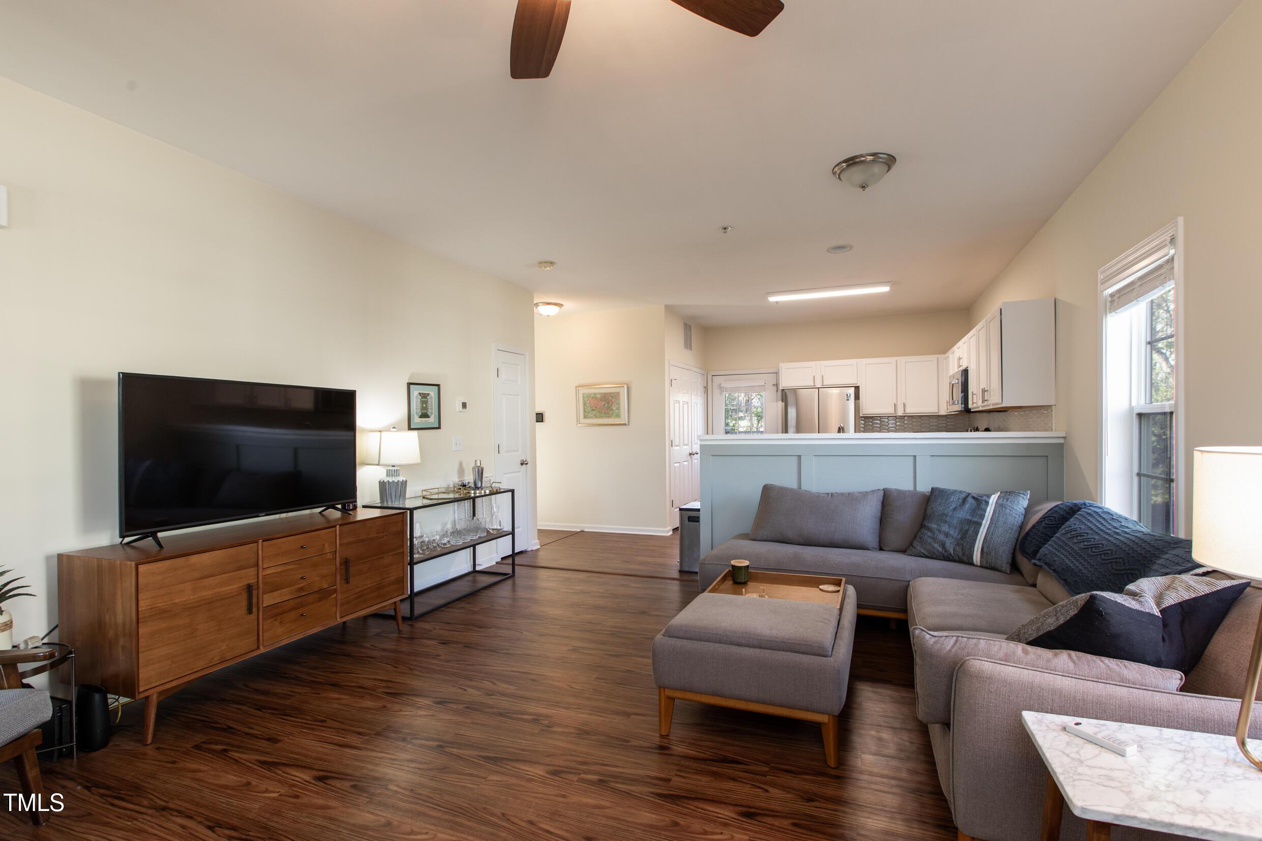 1208 Wall Street Durham, NC 27701 - Photo 4 of 16 a living room with furniture and a flat screen tv