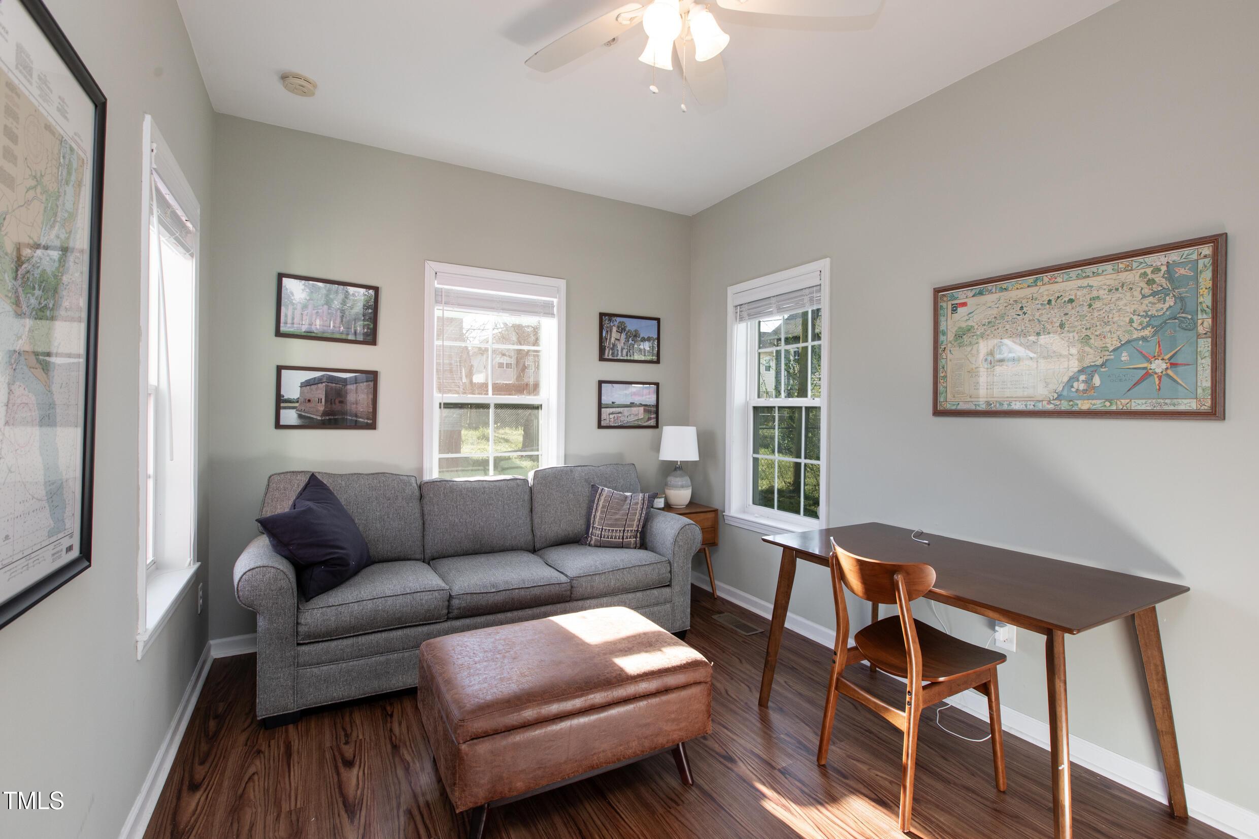 1208 Wall Street Durham, NC 27701 - Photo 9 of 16 a living room with furniture a couch and two windows