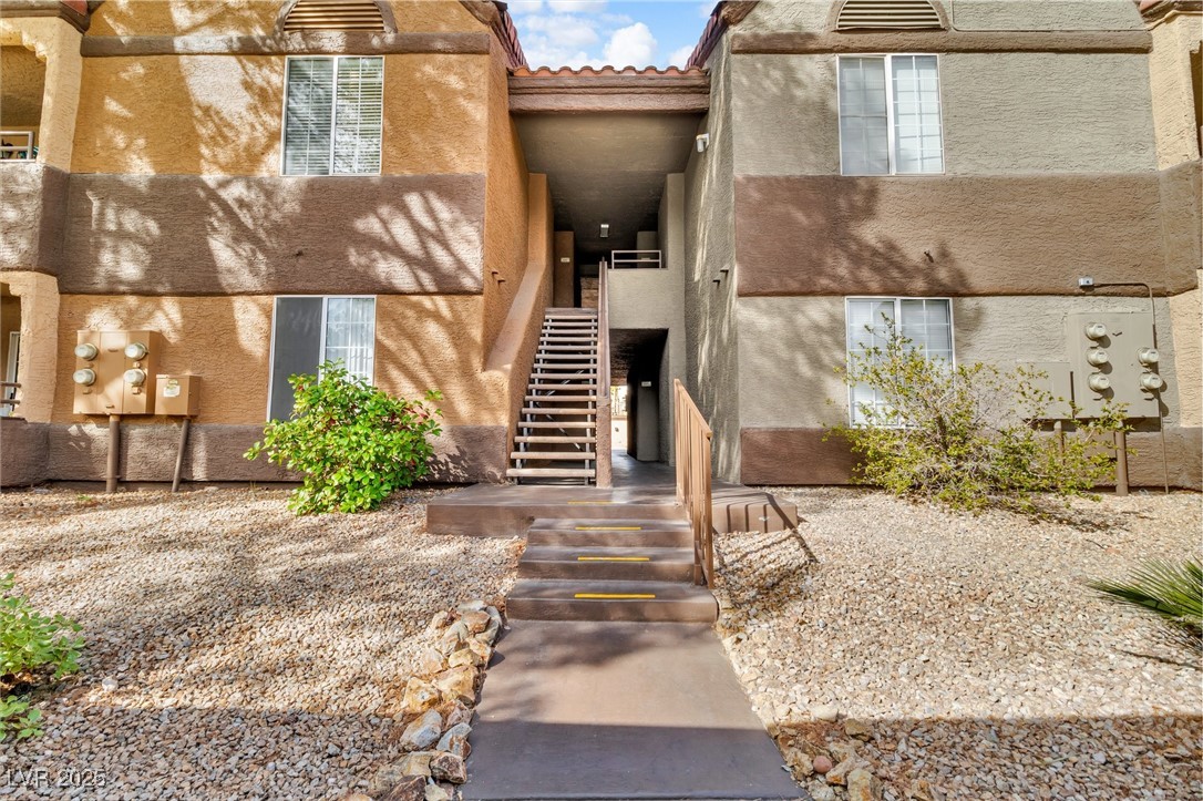 2200 South Fort Apache Road, Unit 1007 Las Vegas, NV 89117 - Photo 1 of 30 View of exterior entry with a tile roof and stucco siding
