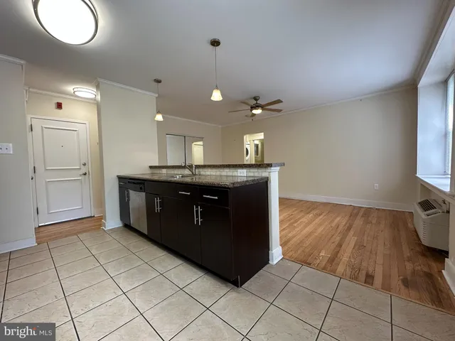 a kitchen with stainless steel appliances granite countertop a sink and cabinets