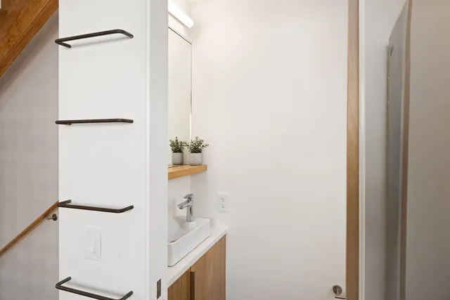 a kitchen with stainless steel appliances granite countertop a sink and a stove