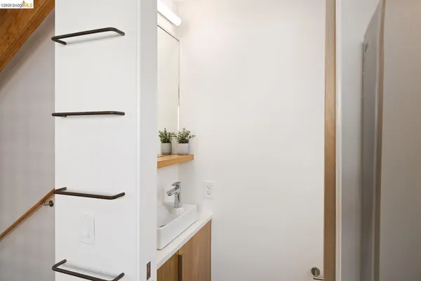 a kitchen with stainless steel appliances granite countertop a sink and a stove