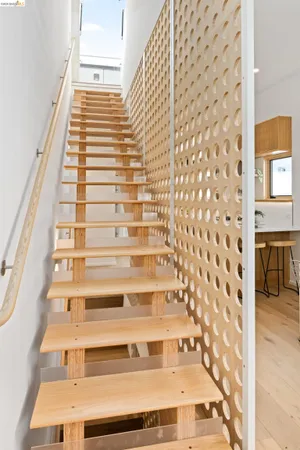 a view of a balcony with couches and wooden floor