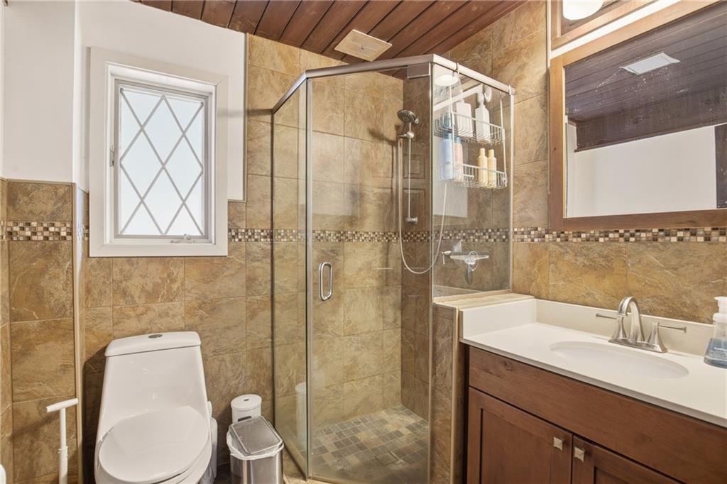 427 Wenatchee Path Central City, PA 15926 - Photo 19 of 42 a bathroom with a toilet sink a shower and a mirror