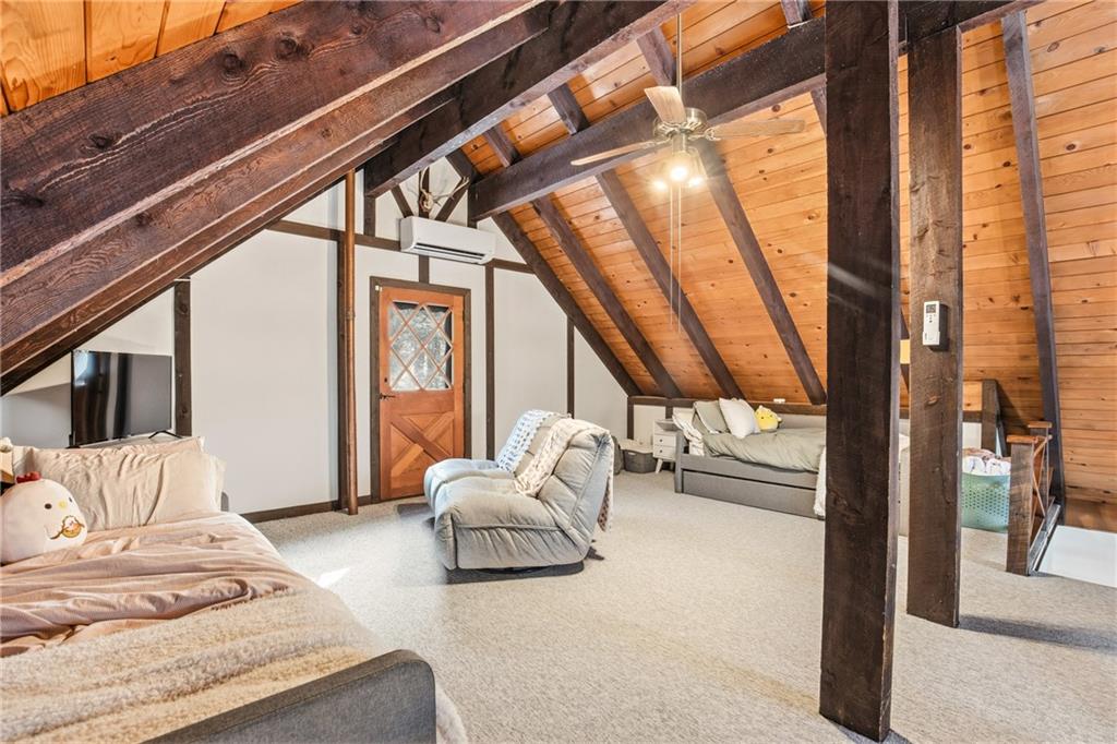 427 Wenatchee Path Central City, PA 15926 - Photo 22 of 42 a bedroom with furniture and a large window