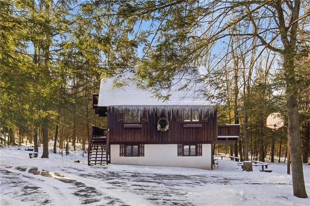 427 Wenatchee Path Central City, PA 15926 - Photo 34 of 42 a front view of a house with a tree
