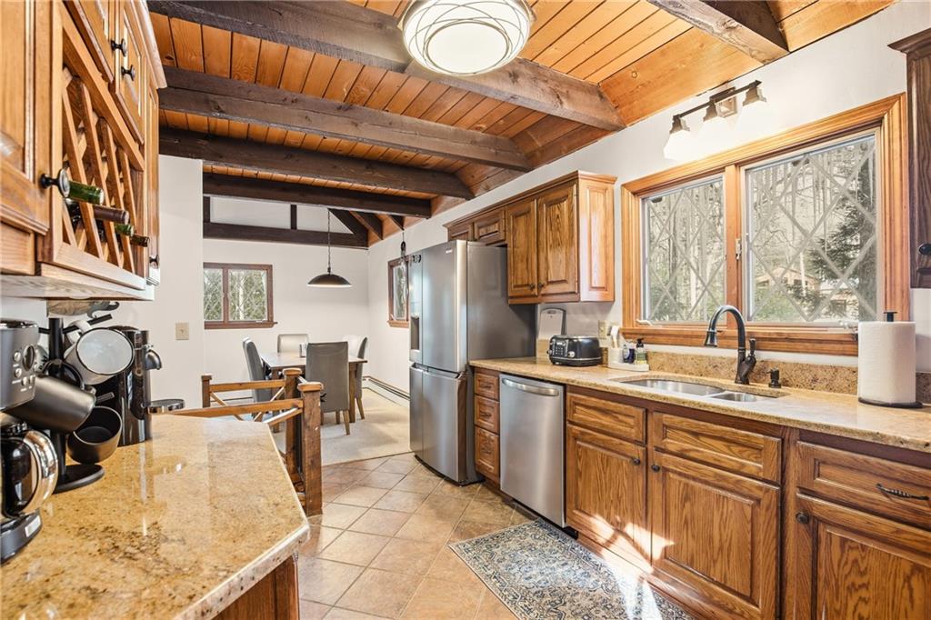 427 Wenatchee Path Central City, PA 15926 - Photo 5 of 42 a kitchen with stainless steel appliances granite countertop sink stove and cabinets