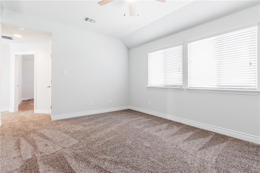 2104 Pindos Pony Way Georgetown, TX 78626 - Photo 19 of 30 A spacious room offers comfortable carpeting and natural illumination through dual windows.