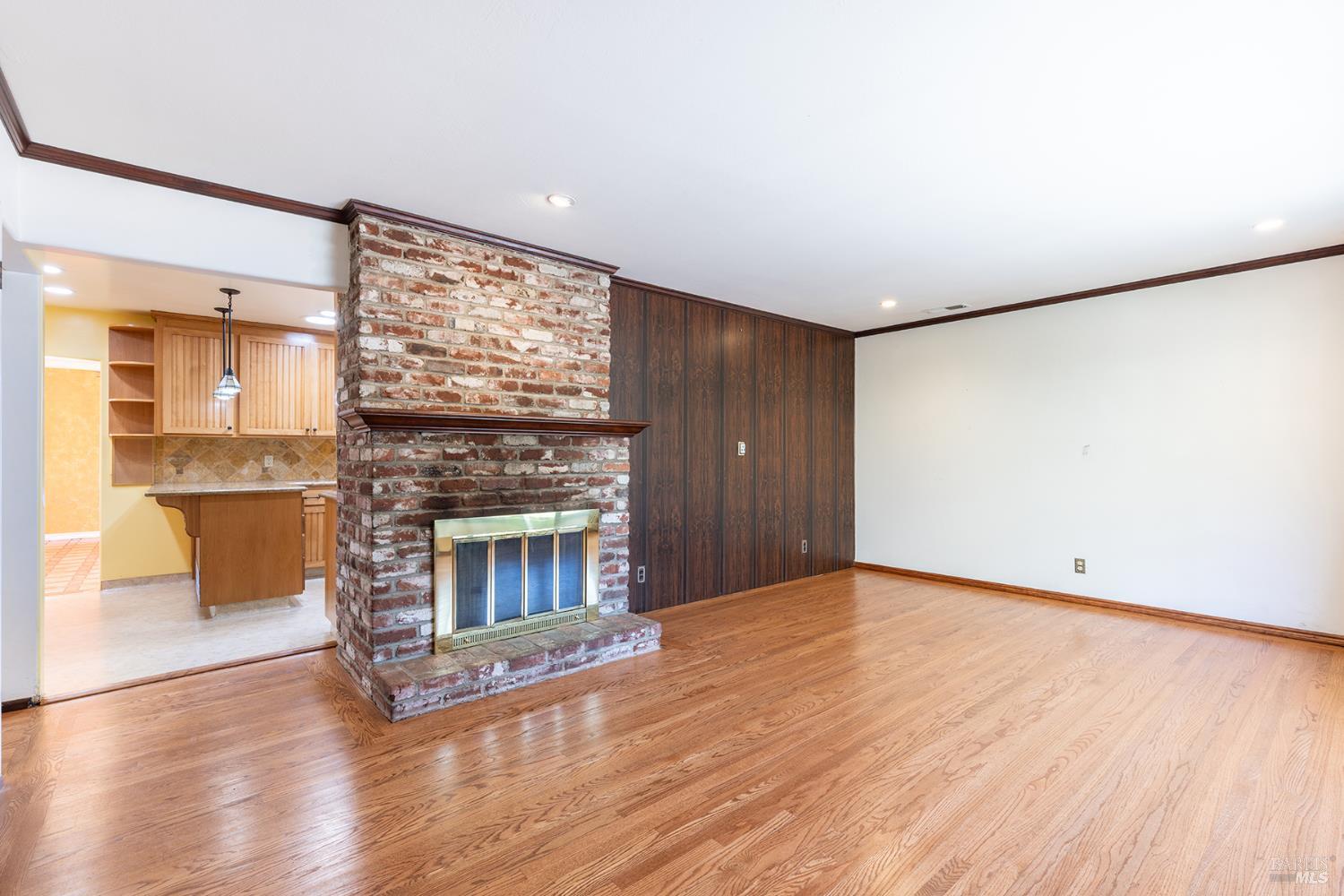 2236 West Hearn Avenue Santa Rosa, CA 95407 - Photo 10 of 56 an empty room with wooden floor fireplace and windows