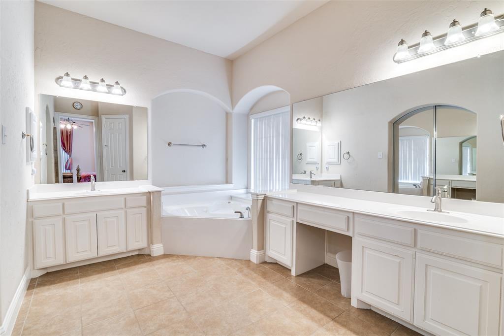 1113 Waterford Way Allen, TX 75013 - Photo 20 of 36 a spacious bathroom with a double vanity sink mirror and bathtub