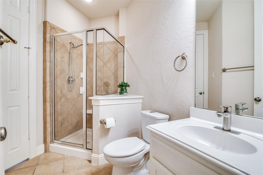1113 Waterford Way Allen, TX 75013 - Photo 21 of 36 a bathroom with a sink toilet and shower