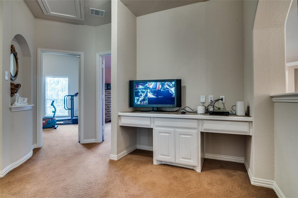 1113 Waterford Way Allen, TX 75013 - Photo 26 of 36 a living room with furniture a flat screen tv and a fireplace