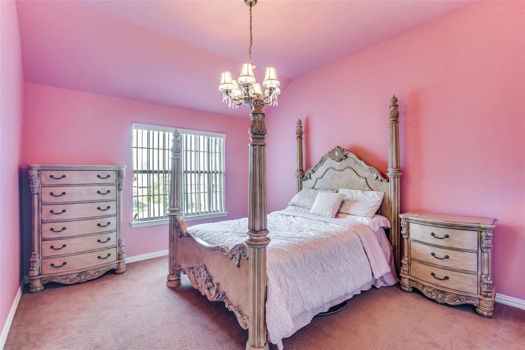 1113 Waterford Way Allen, TX 75013 - Photo 27 of 36 a bed room with a bed and a dresser