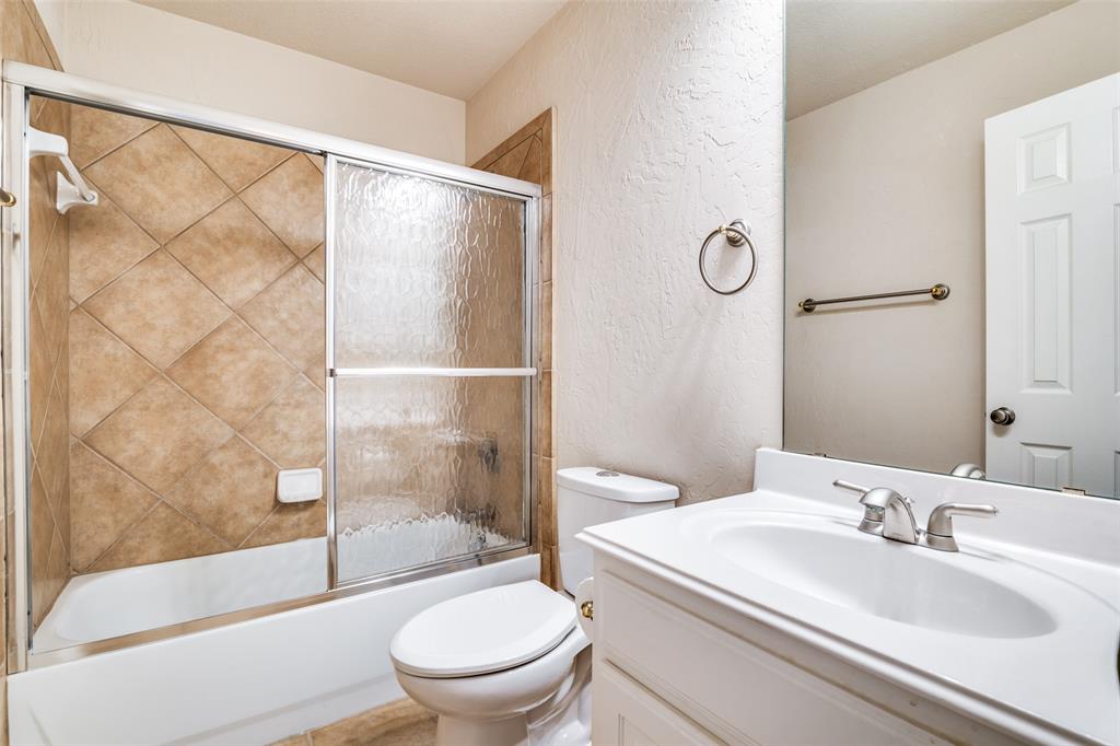 1113 Waterford Way Allen, TX 75013 - Photo 29 of 36 a bathroom with a sink toilet and shower