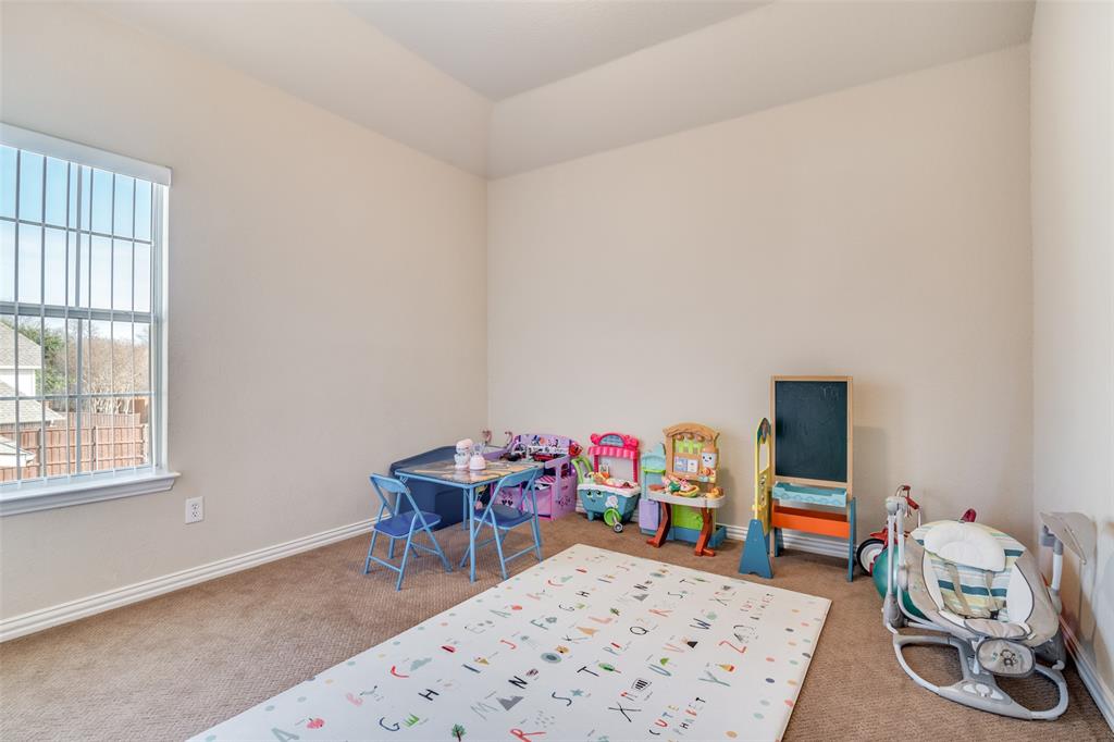1113 Waterford Way Allen, TX 75013 - Photo 32 of 36 a room with furniture a rug toys and a window