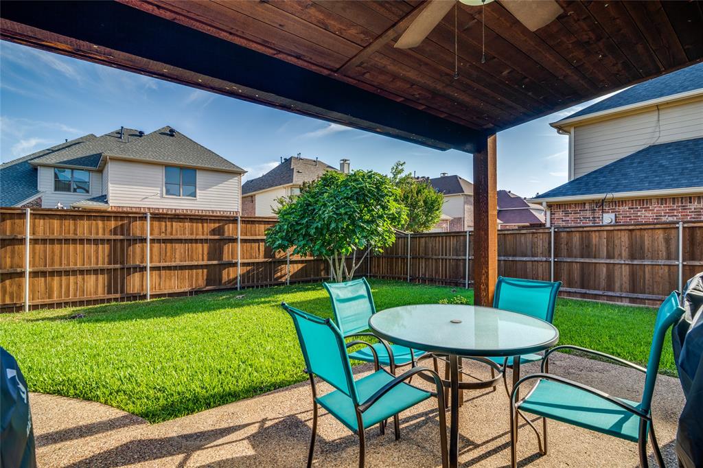 1113 Waterford Way Allen, TX 75013 - Photo 34 of 36 a view of a chairs and table in backyard of the house