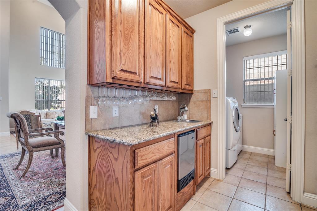 1113 Waterford Way Allen, TX 75013 - Photo 9 of 36 a kitchen that has a sink and a stove in it