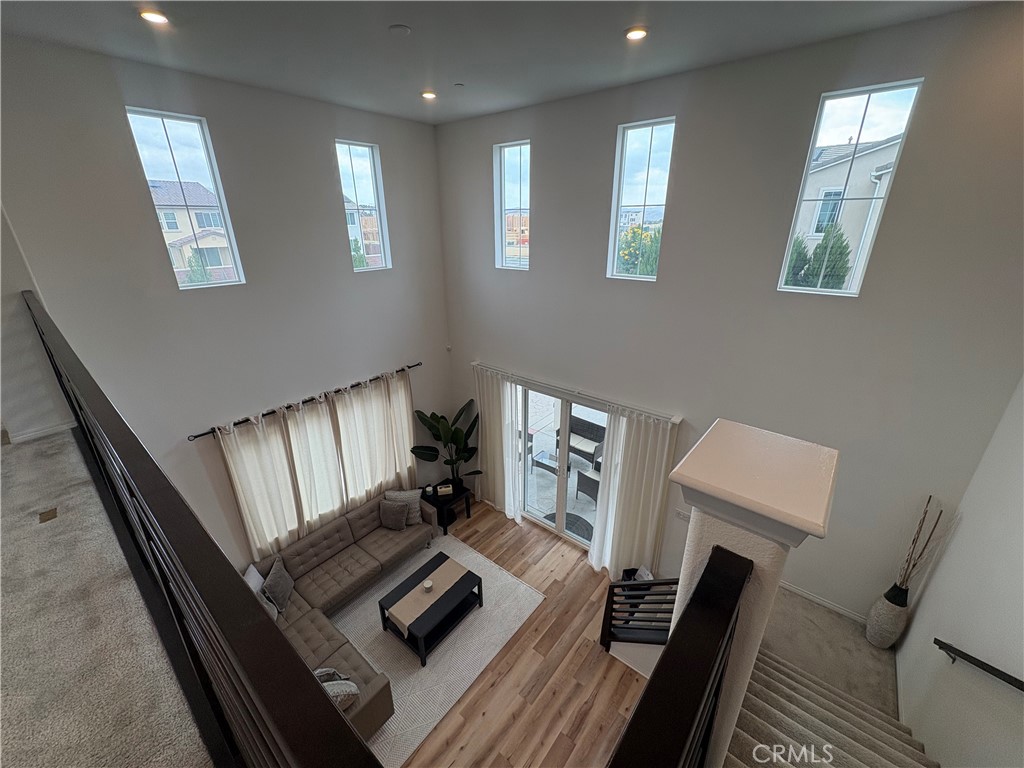 8529 Exposition Street Chino, CA 91708 - Photo 11 of 42 a living room with furniture and a window