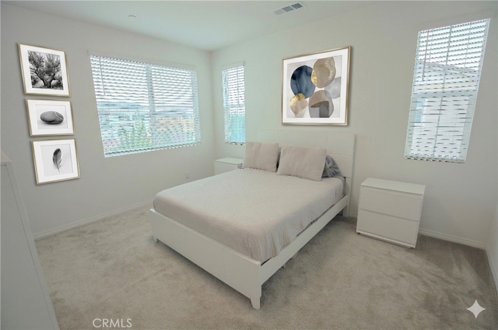8529 Exposition Street Chino, CA 91708 - Photo 12 of 42 a bedroom with a bed and a window