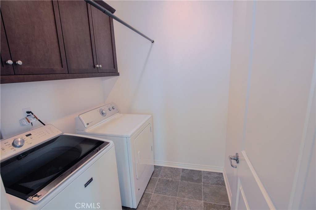 8529 Exposition Street Chino, CA 91708 - Photo 17 of 42 a utility room with dryer and washer