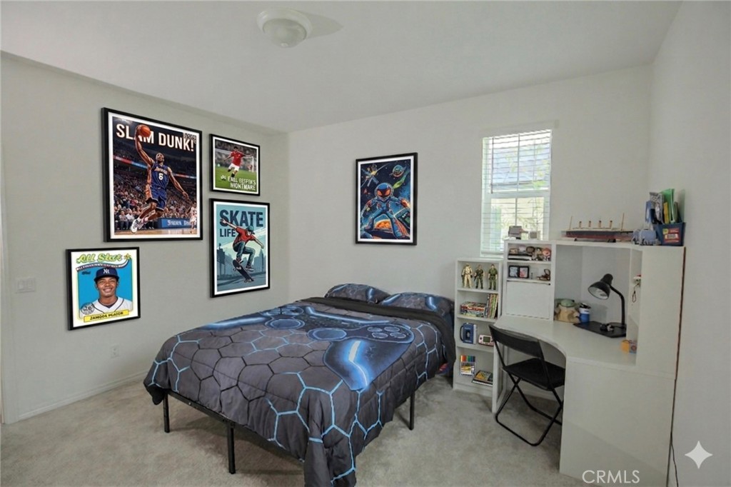 8529 Exposition Street Chino, CA 91708 - Photo 18 of 42 a bedroom with a bed and a desk