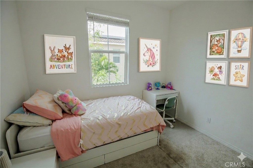 8529 Exposition Street Chino, CA 91708 - Photo 20 of 42 a bedroom with a bed and a window