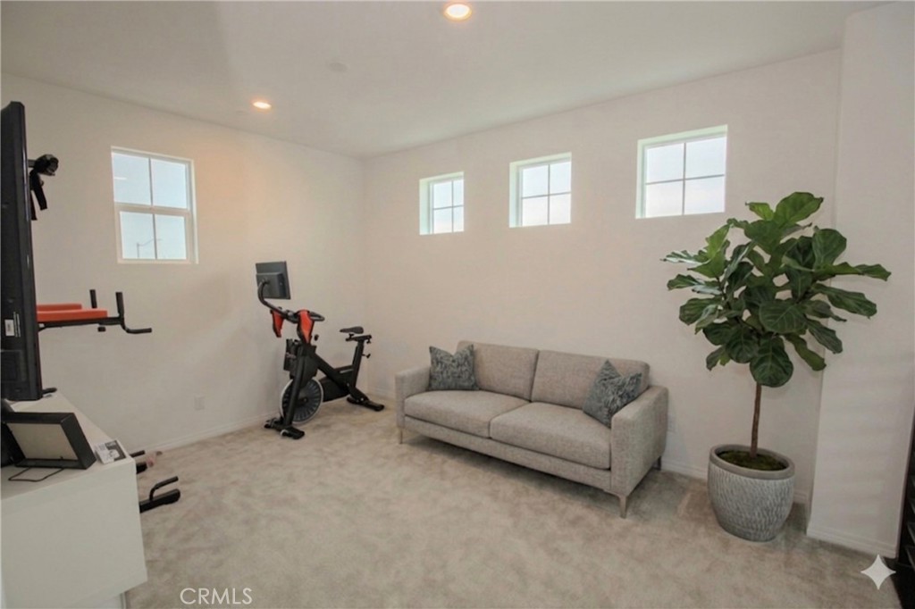 8529 Exposition Street Chino, CA 91708 - Photo 21 of 42 a living room with furniture and a potted plant