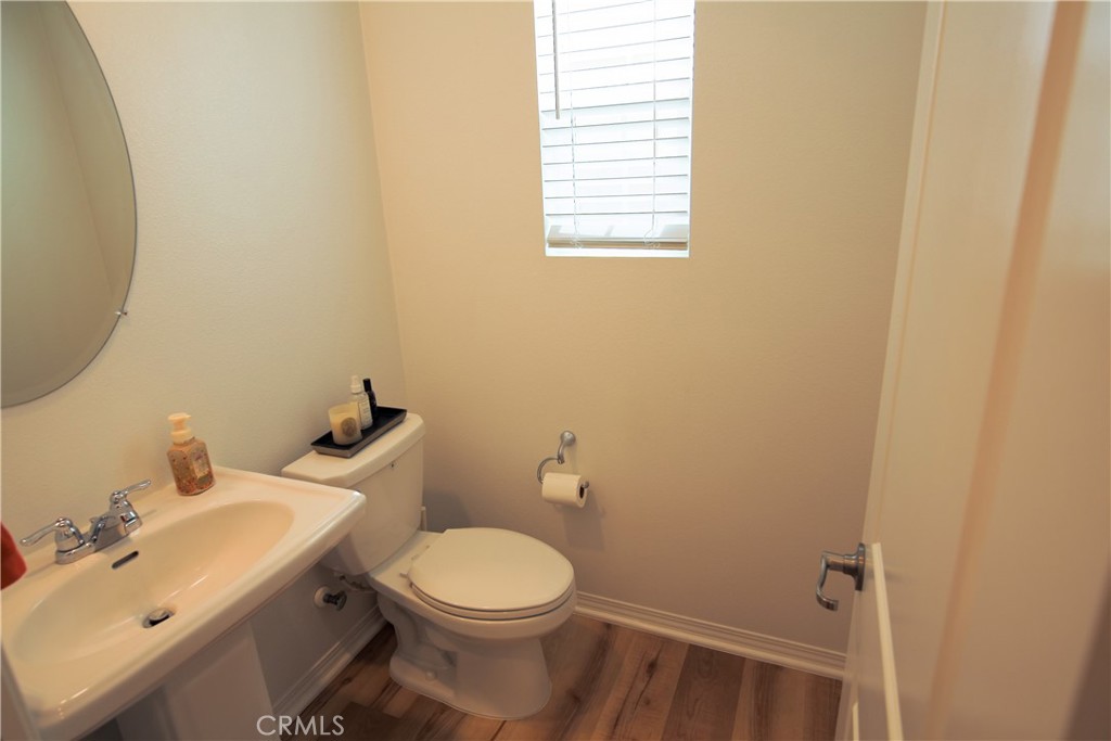 8529 Exposition Street Chino, CA 91708 - Photo 24 of 42 a bathroom with a sink and a toilet