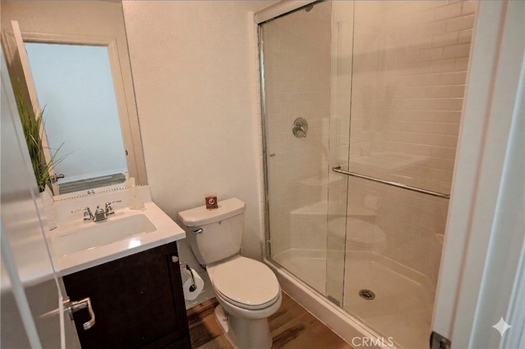 8529 Exposition Street Chino, CA 91708 - Photo 27 of 42 a bathroom with a sink toilet and shower