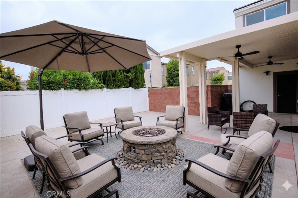 8529 Exposition Street Chino, CA 91708 - Photo 29 of 42 a view of a patio with furniture and table