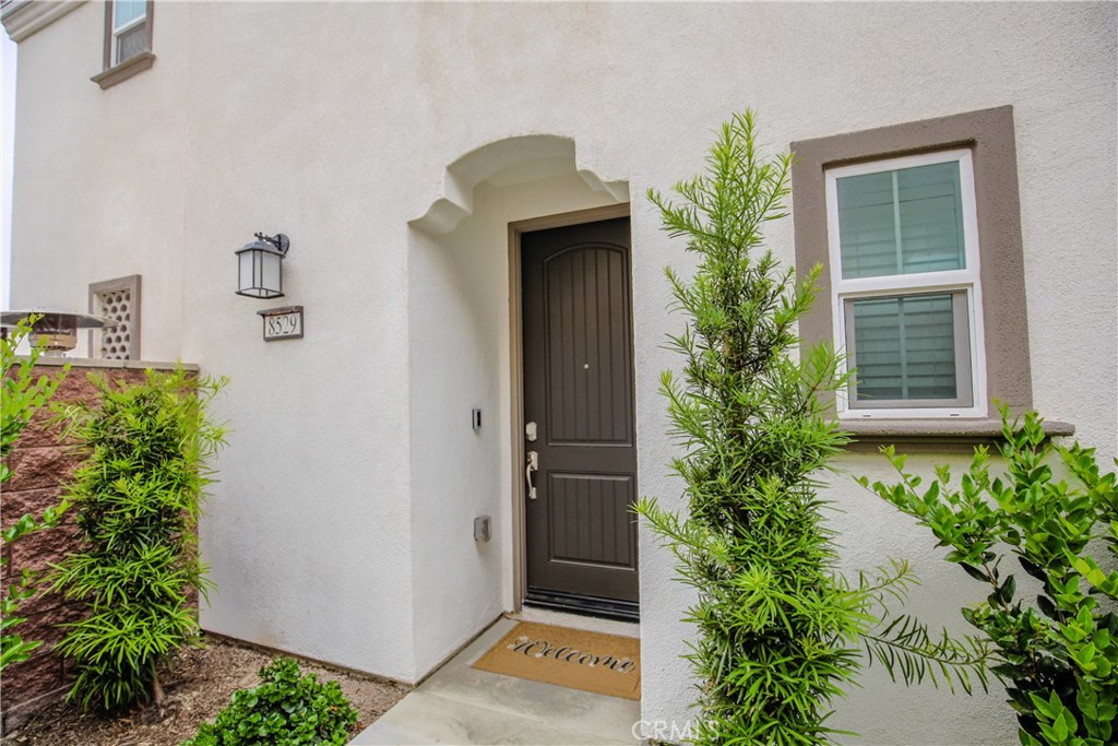 8529 Exposition Street Chino, CA 91708 - Photo 3 of 42 a front view of a house with a garage