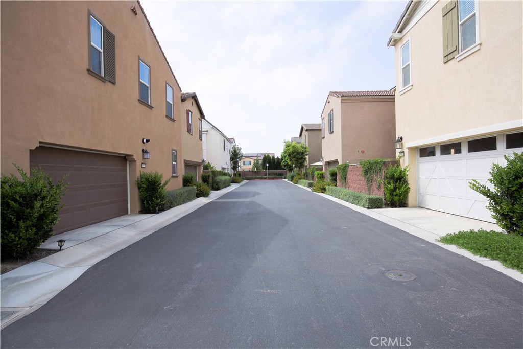 8529 Exposition Street Chino, CA 91708 - Photo 31 of 42 a view of a street with a house