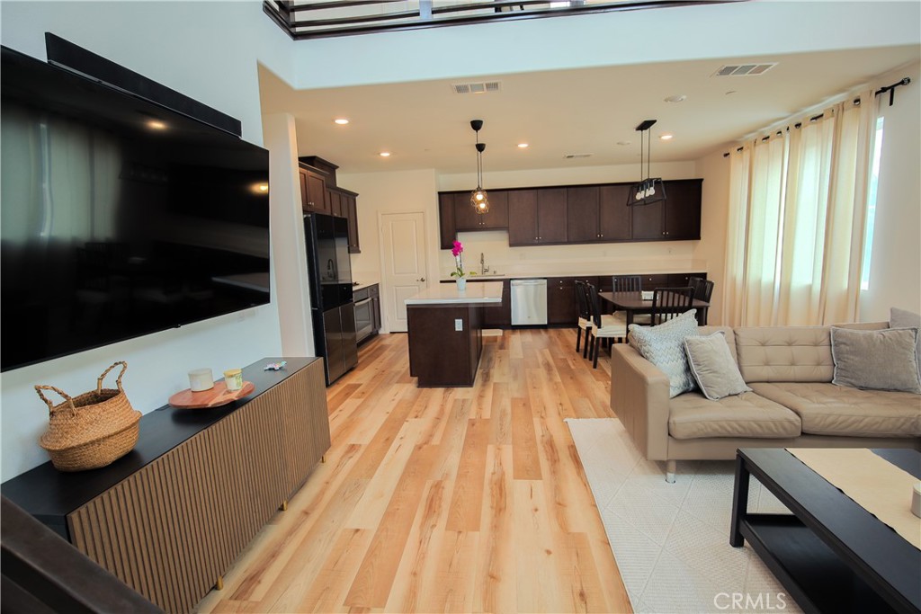 8529 Exposition Street Chino, CA 91708 - Photo 9 of 42 a living room with furniture and a flat screen tv