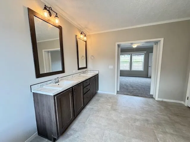 a bathroom with a sink a mirror a vanity and bathtub