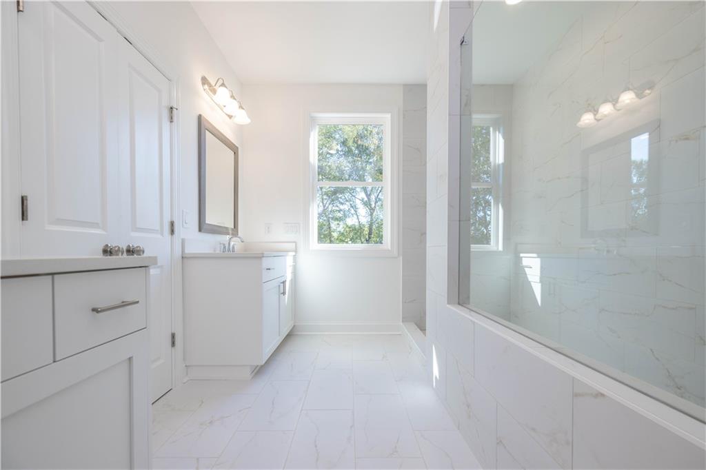 2240 Siskin Sq Road, Unit 88 Duluth, GA 30096 - Photo 23 of 42 a bathroom with a sink vanity and mirror