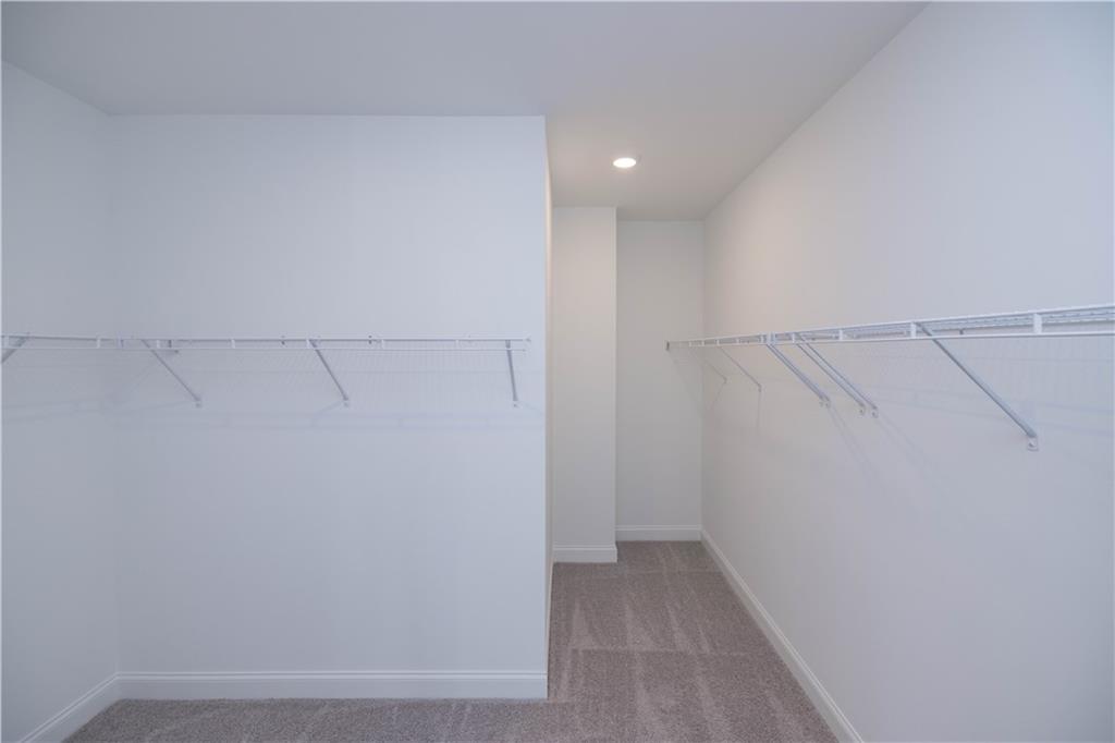 2240 Siskin Sq Road, Unit 88 Duluth, GA 30096 - Photo 26 of 42 a view of a room with racks on the wall