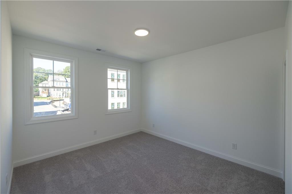 2240 Siskin Sq Road, Unit 88 Duluth, GA 30096 - Photo 27 of 42 an empty room with windows