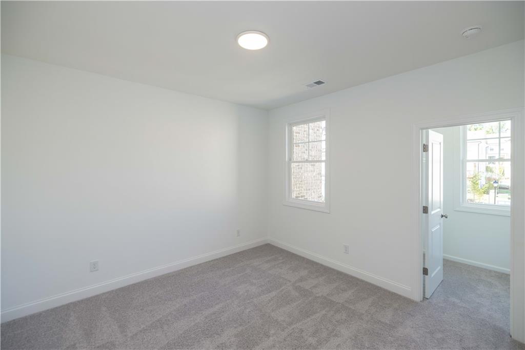 2240 Siskin Sq Road, Unit 88 Duluth, GA 30096 - Photo 29 of 42 an empty room with windows