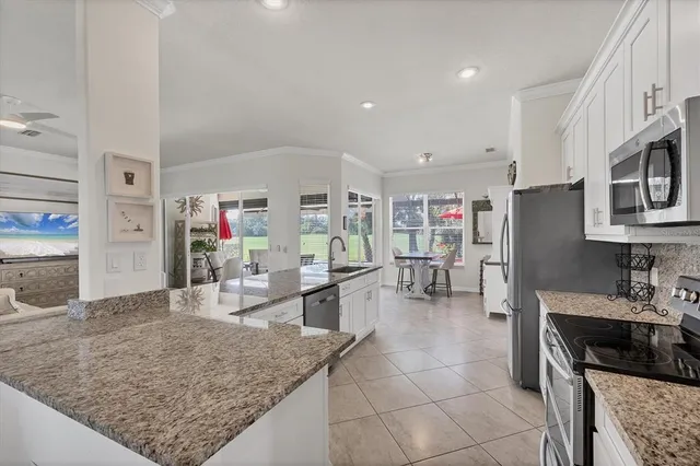 an aerial view of a house with a ocean view