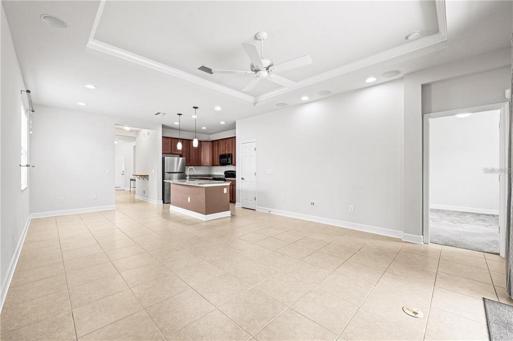 8437 Nandina Drive Sarasota, FL 34240 - Photo 12 of 26 a large white kitchen with a stove a refrigerator and a sink